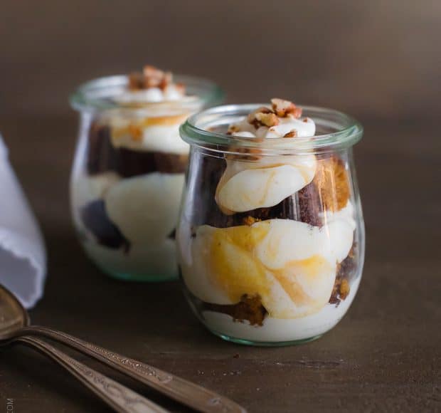 Pumpkin Bread Parfaits in glass jars with spoons alongside.