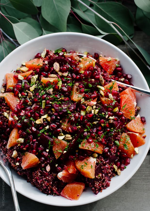 Quinoa Salad with Roasted Red Beets, Oranges and Pomegranate in a serving bowl.