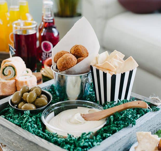 Roasted Eggplant Falafel Bites served with hummus and other game day appetizers.