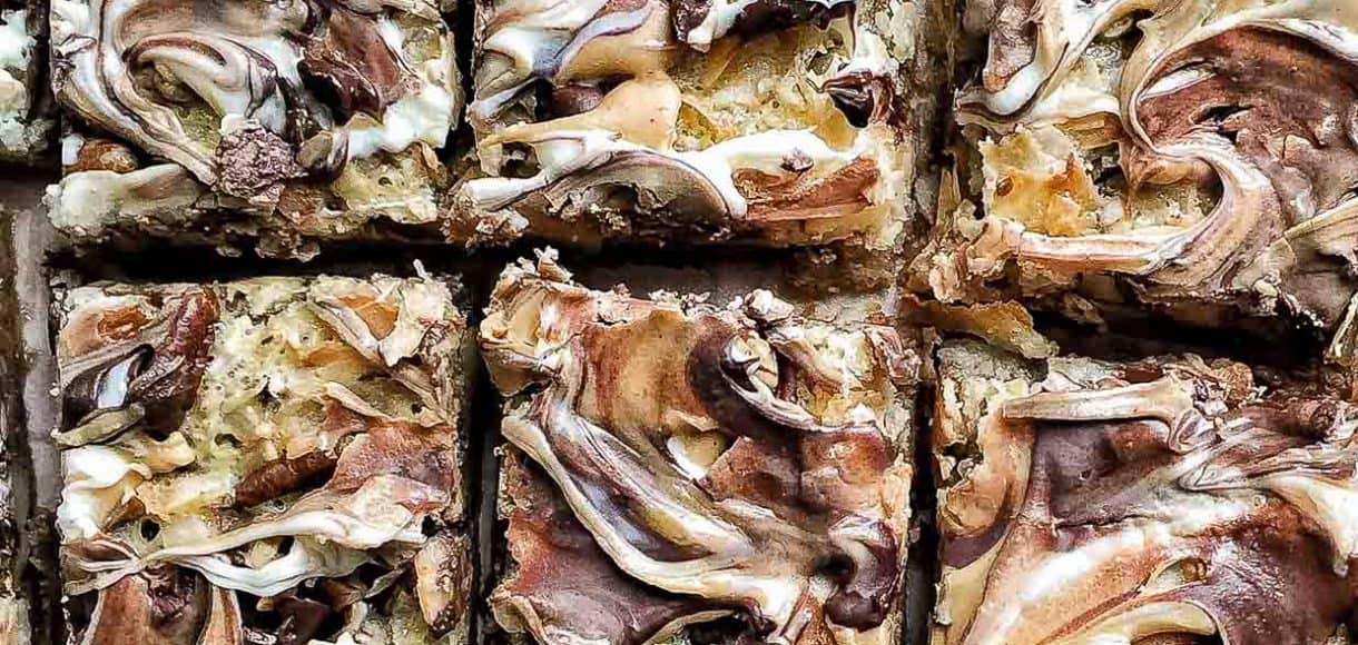 Close up view of a pan of freshly baked 7 Layer Bars.