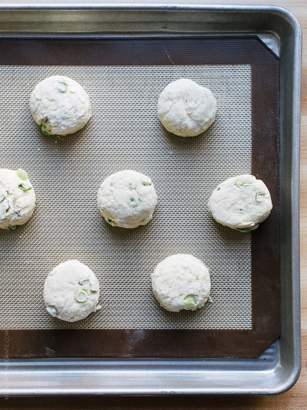 Cream Cheese and Green Onion Biscuits on a baking sheet ready for the oven.