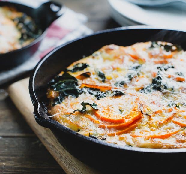 A cast iron skillet filled with a freshly baked Spiralized Sweet Potato Kale Egg White Frittata.