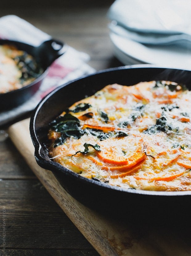 A cast iron skillet filled with a freshly baked Spiralized Sweet Potato Kale Egg White Frittata.