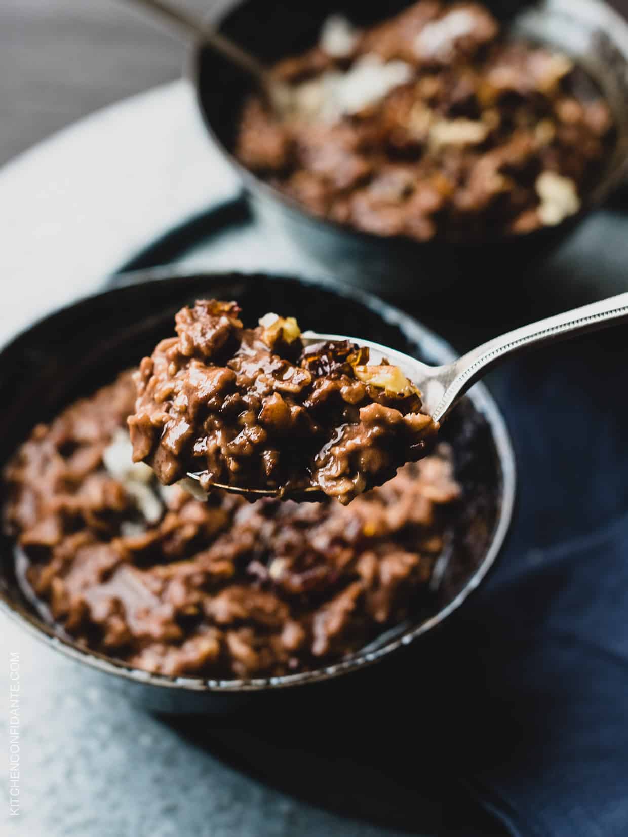 A closeup view of a spoonful of wholesome and delicious Chocolate Coconut Oat Porridge. 