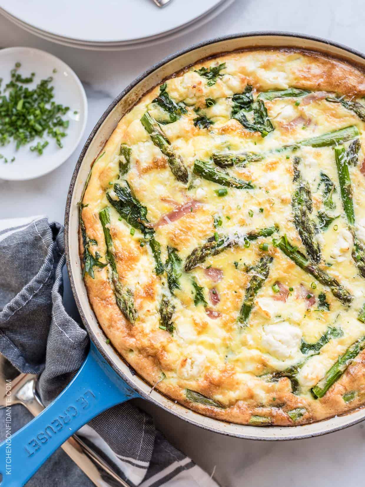 A view from the top of a freshly baked asparagus frittata.