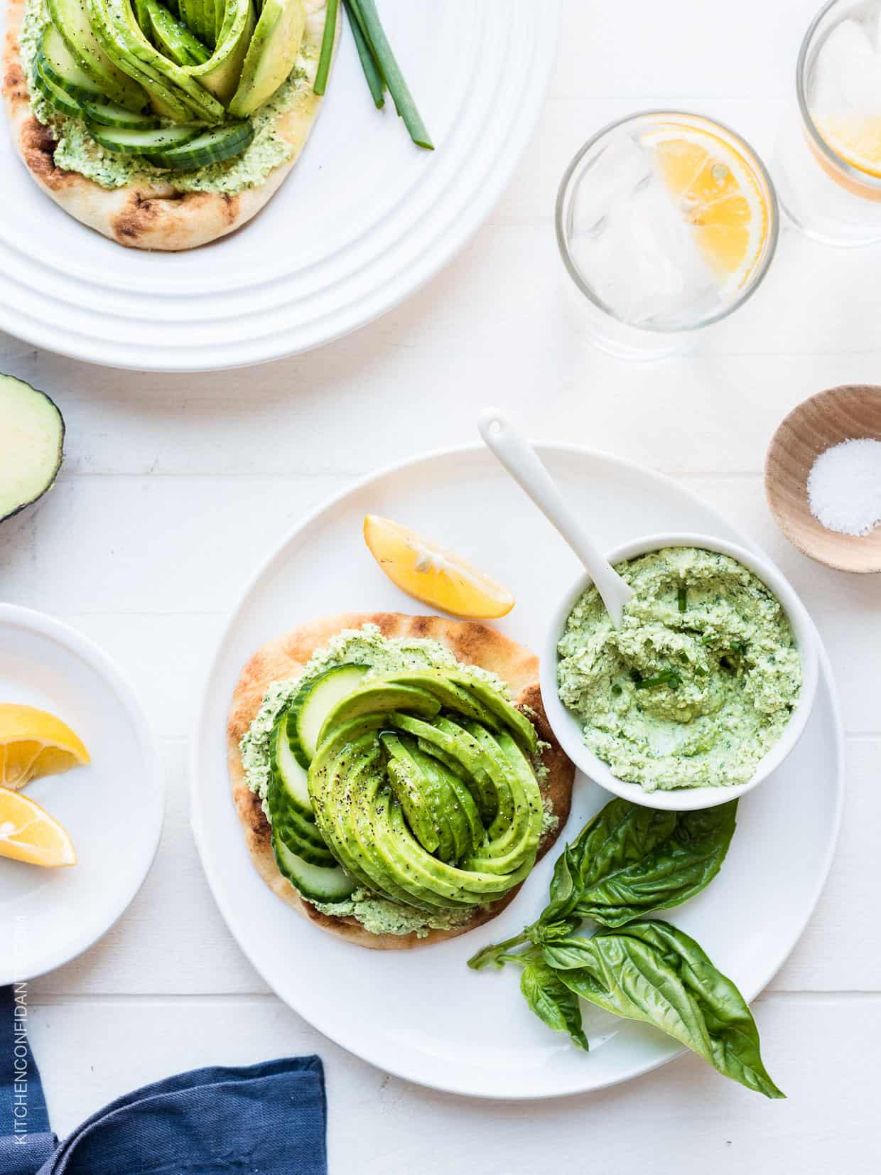 A toasted naan topped with Green Goddess feta spread and an avocado rose.