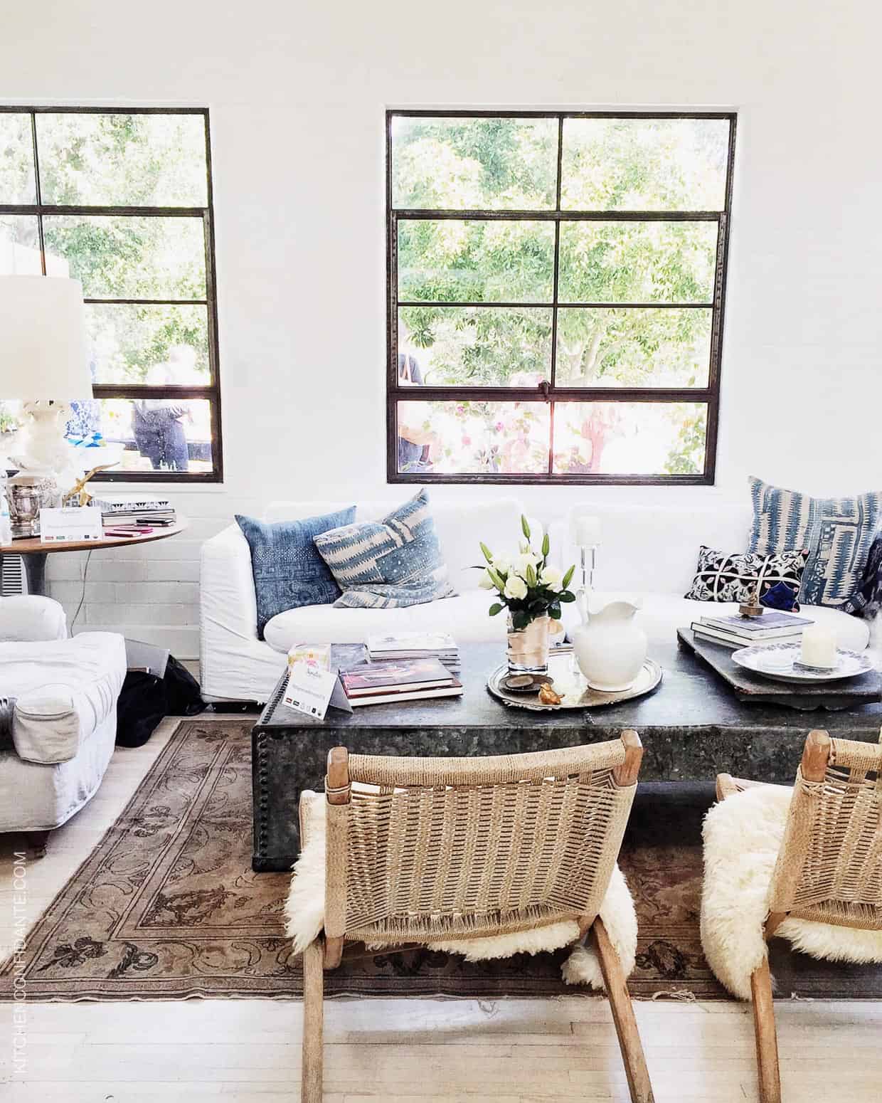 Chairs, sofa, and a coffee table overlooking the Hollywood Hills.