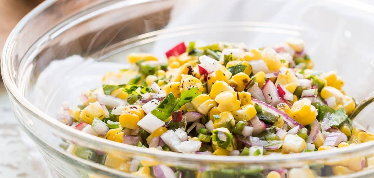 Grilled Corn and Poblano Salad in a glass bowl.