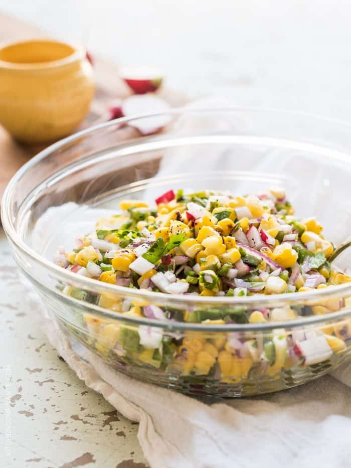Grilled Corn and Poblano Salad in a glass bowl.