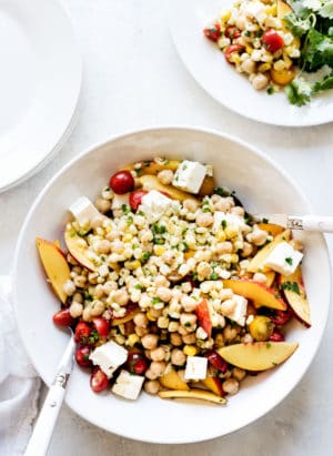 Tomato, Corn and Nectarine Chickpea Salad -- all of your favorite summer fruits and vegetables, in a vibrant summer salad! This is guaranteed to become a go-to all season long.