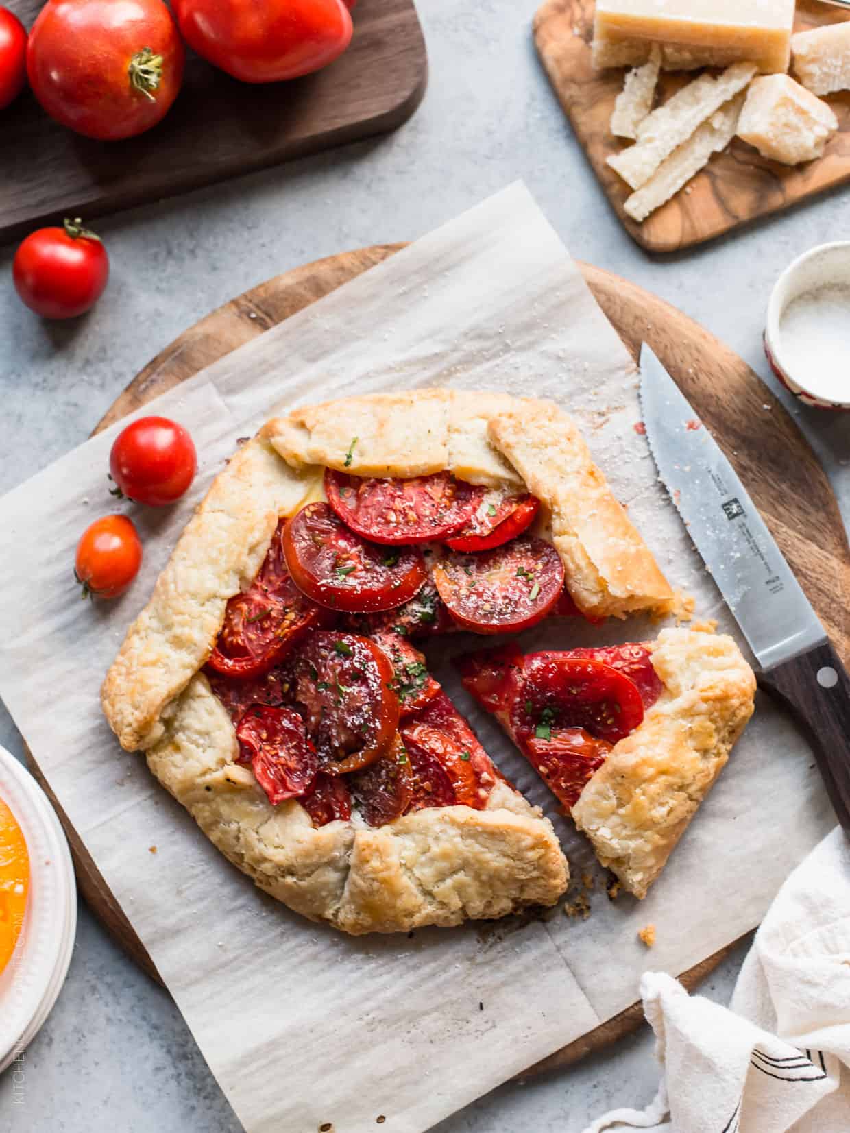 Cutting a slice from a Tomato Ricotta Galette.