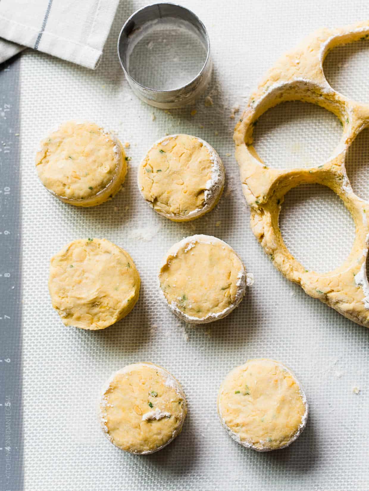 Pumpkin Cheddar Biscuits cut with a round cutter and ready to be baked.