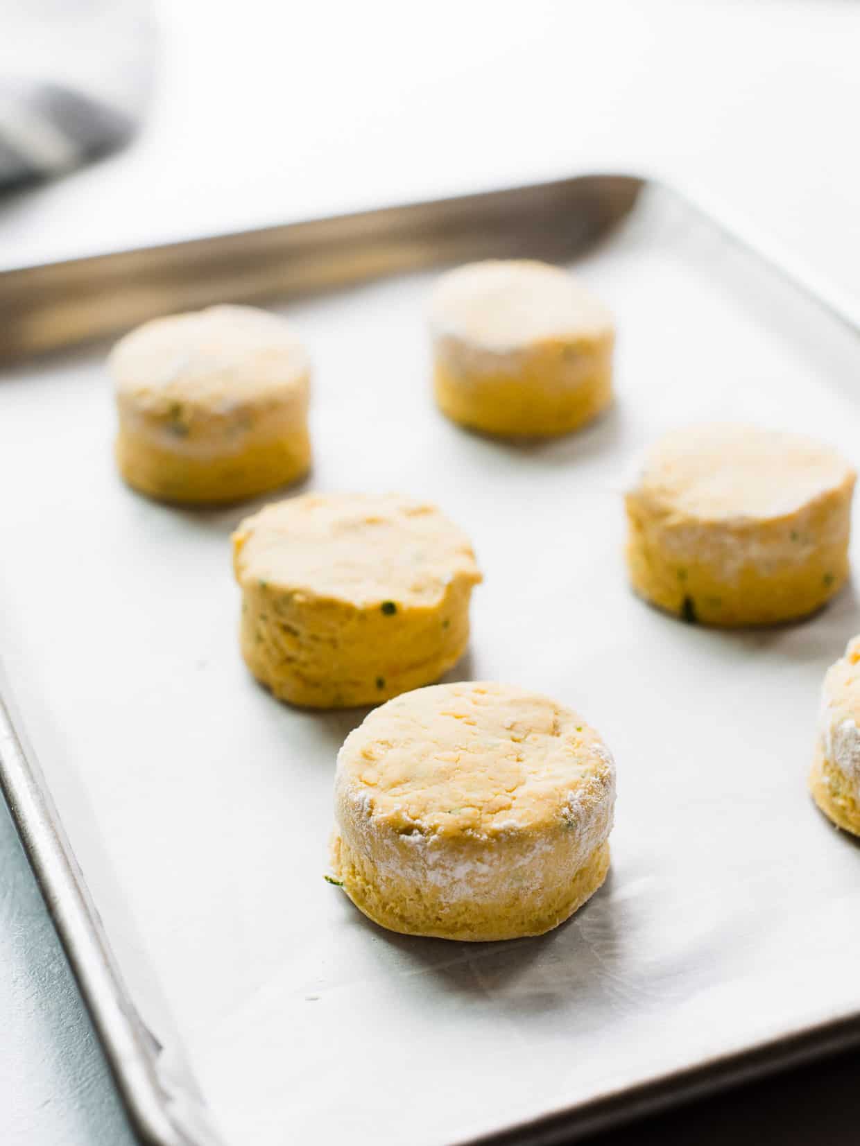 Pumpkin Cheddar Biscuits on a baking tray ready to go into the oven.