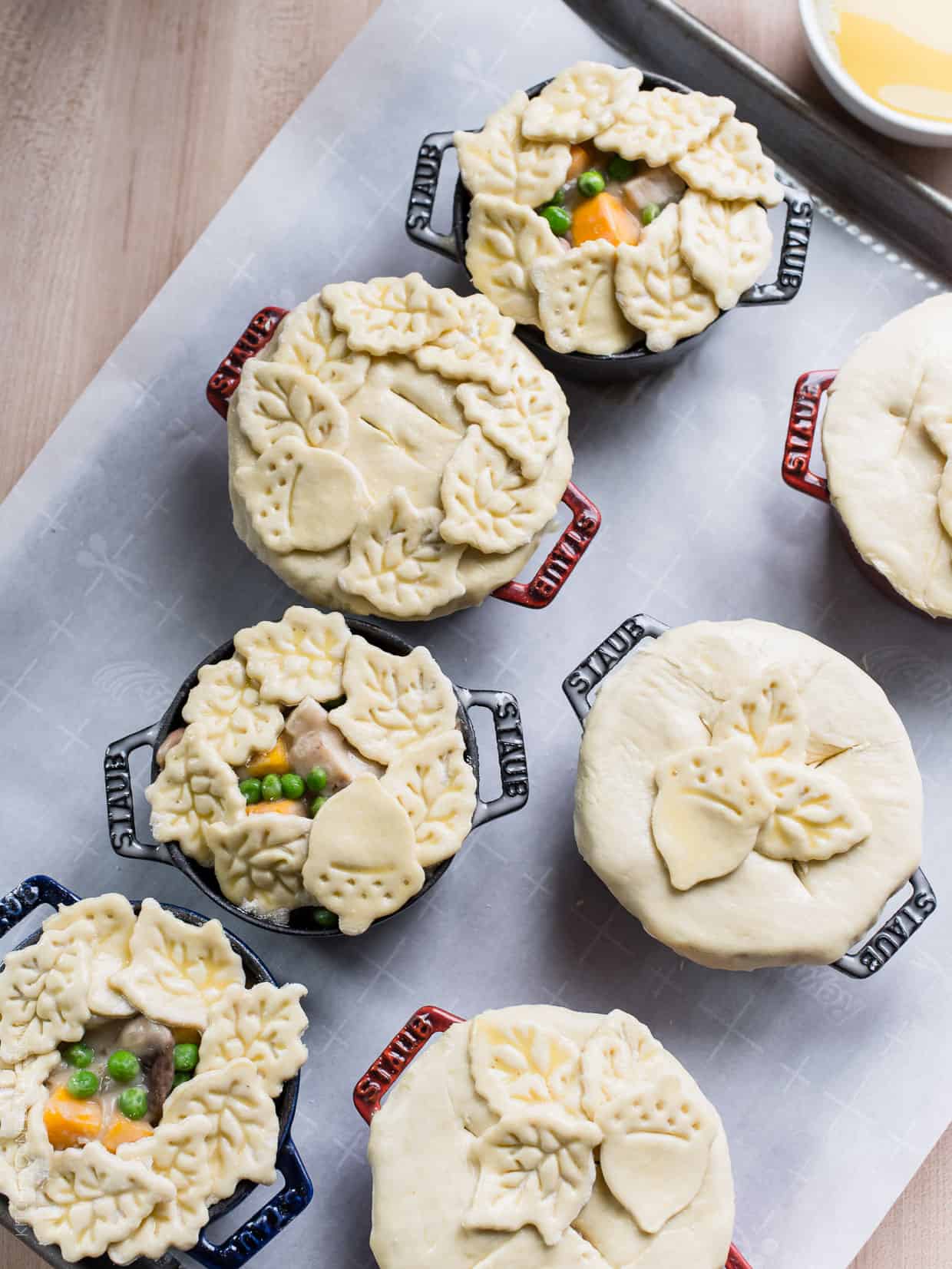 Turkey Pumpkin Pot Pies prepared in single serving ramekins and ready to be baked.