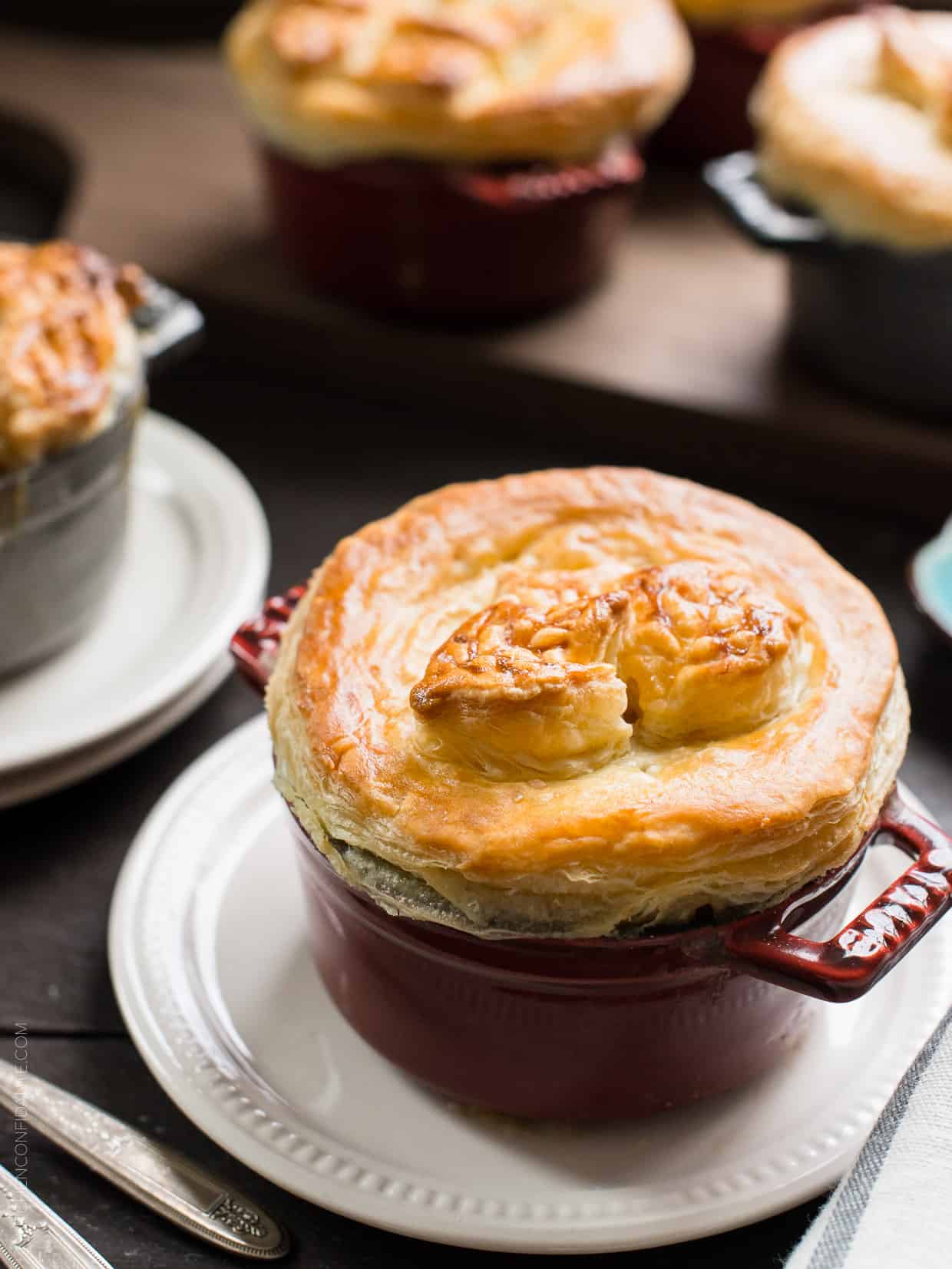 Turkey Pumpkin Pot Pie topped with a thick crust of golden-brown puff pastry.