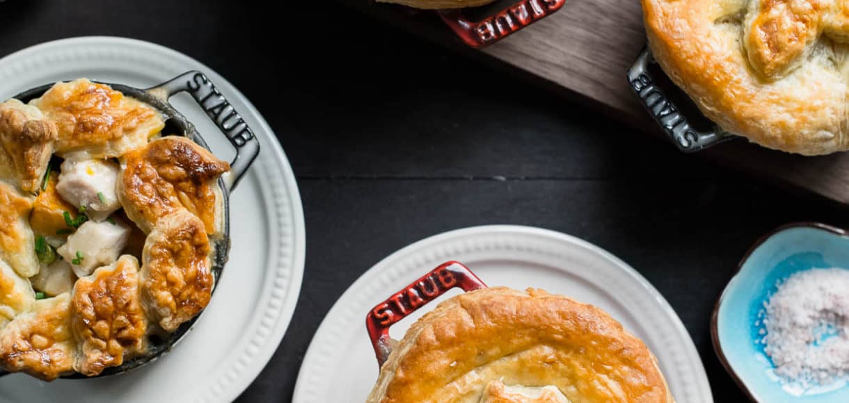 Turkey Pumpkin Pot Pies baked in single serving Dutch ovens and topped with a golden-brown puff pastry crust.