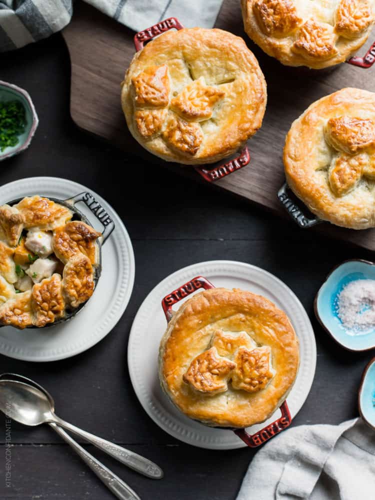 Turkey Pumpkin Pot Pies baked in single serving Dutch ovens and topped with a golden-brown puff pastry crust.