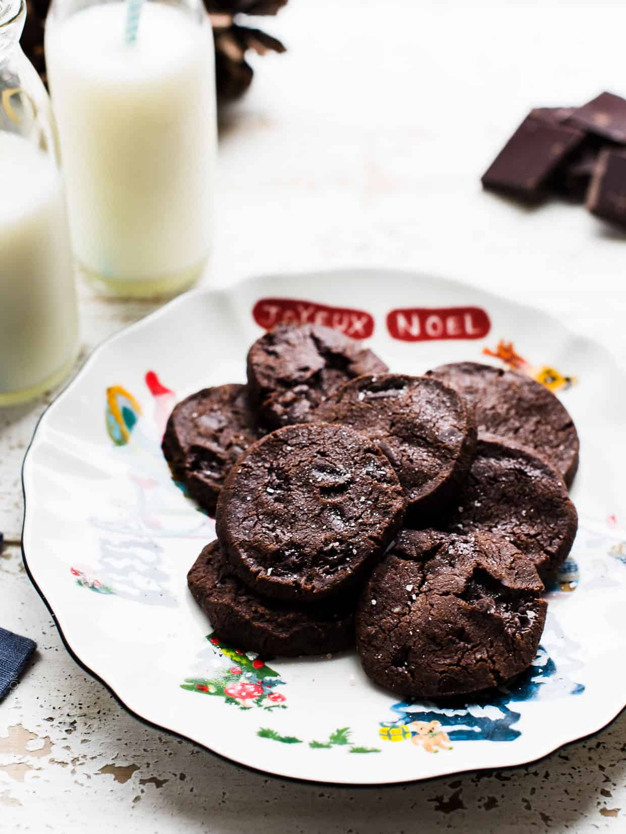 Dorie Greenspan's World Peace Cookies on a Christmas plate with milk.