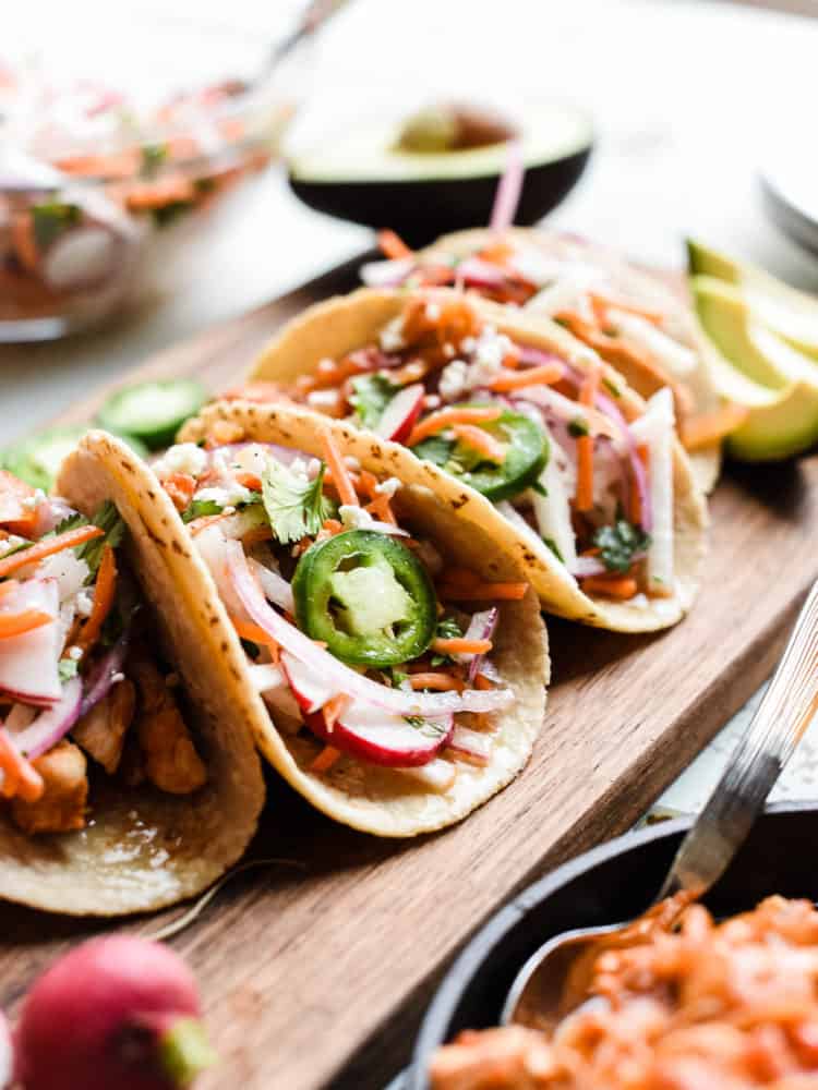 Chipotle Chicken Tacos on a wooden board.