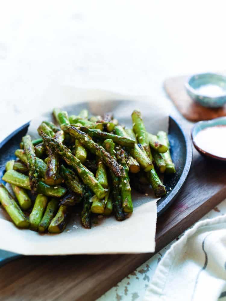 Hot Chili Blistered Asparagus with Sriracha Aioli is simply addictive! They're sure to please a crowd, whether served as an appetizer or a spicy snack