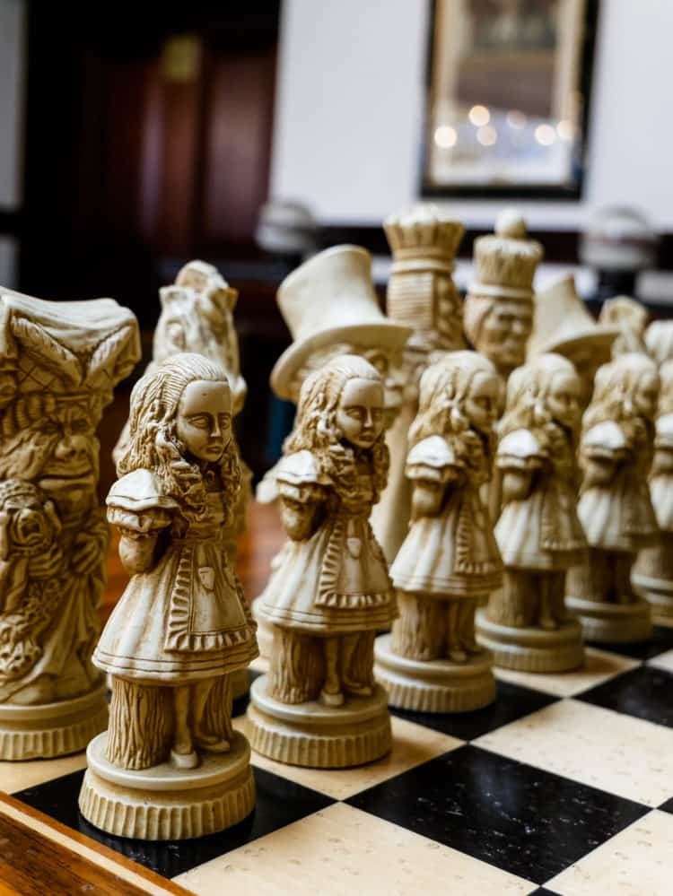 Carved chess pieces on a chessboard.