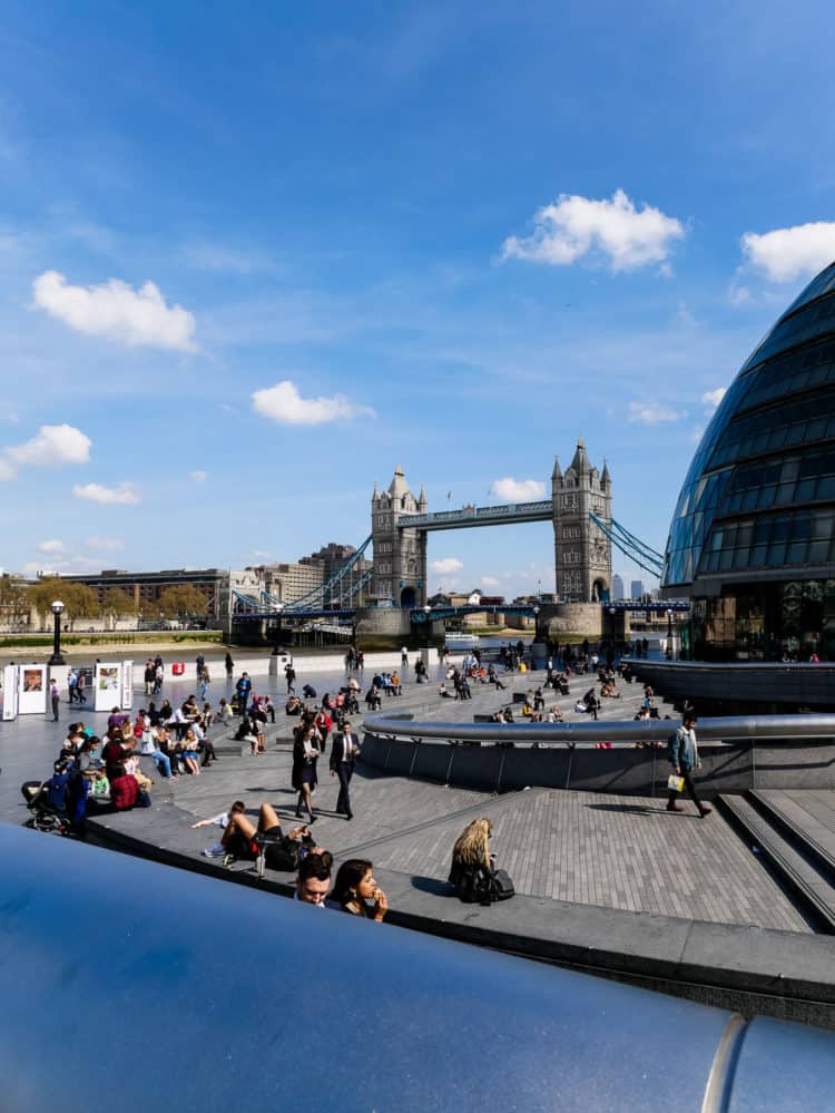 Tower Bridge in London with pedestrians in the foreground.