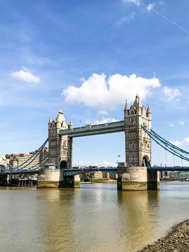 Tower Bridge in London with blue skies and the River Thames.