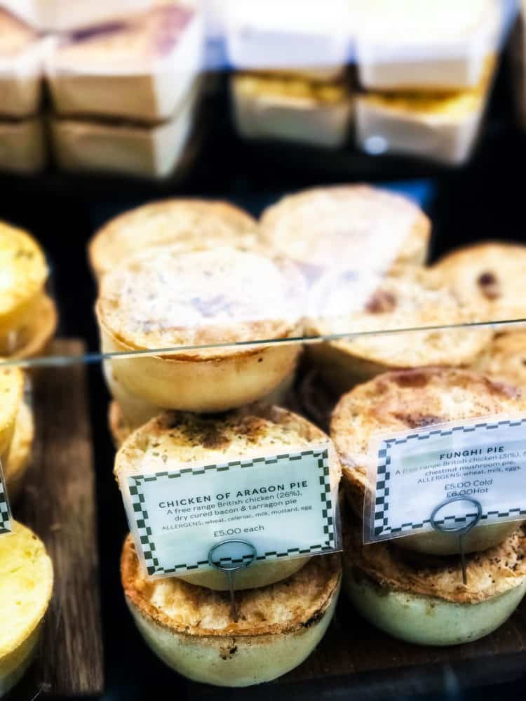 Savory hand pies in a display case at Harrods in London.