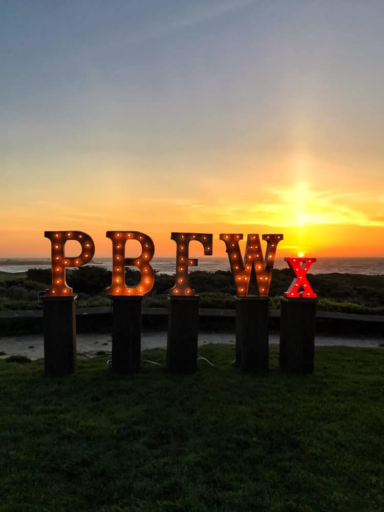 PBFWx sign at sunset at the Pebble Beach Food & Wine.