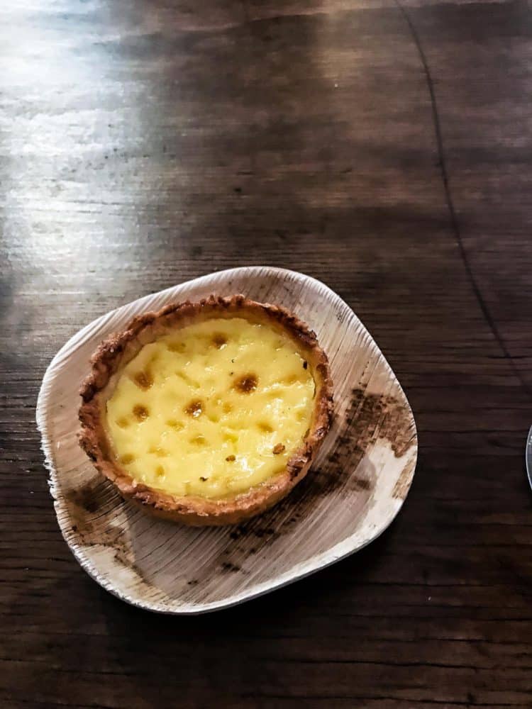 Egg tart in a small bowl on a wooden tabl at the Pebble Beach Food & Wine.