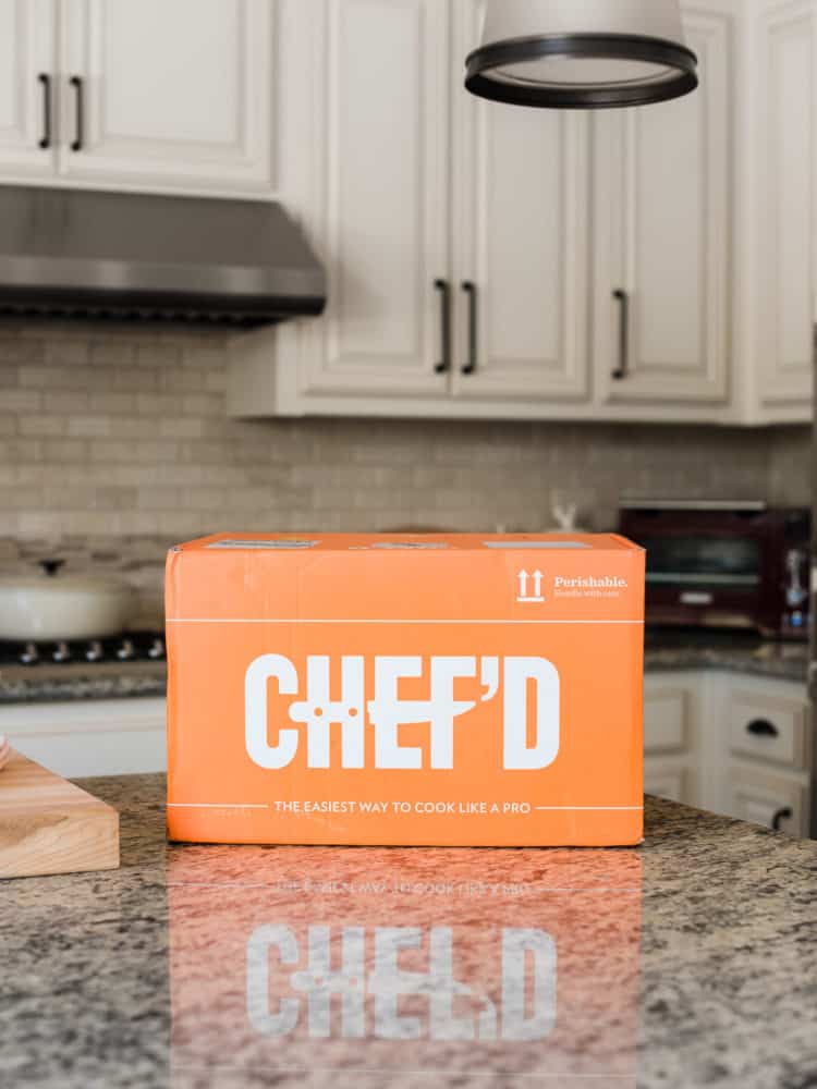 Orange delivery box from Chef'd in a white kitchen