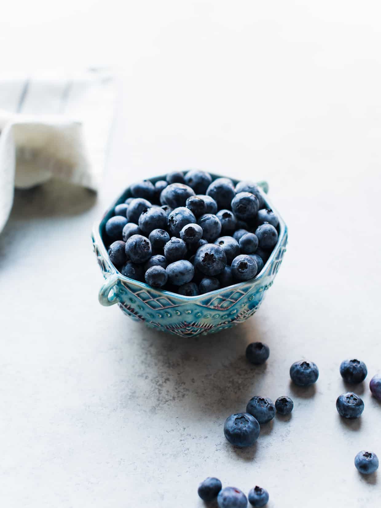 Blueberries in a bowl for Blueberry Açaí Frozen Yogurt.