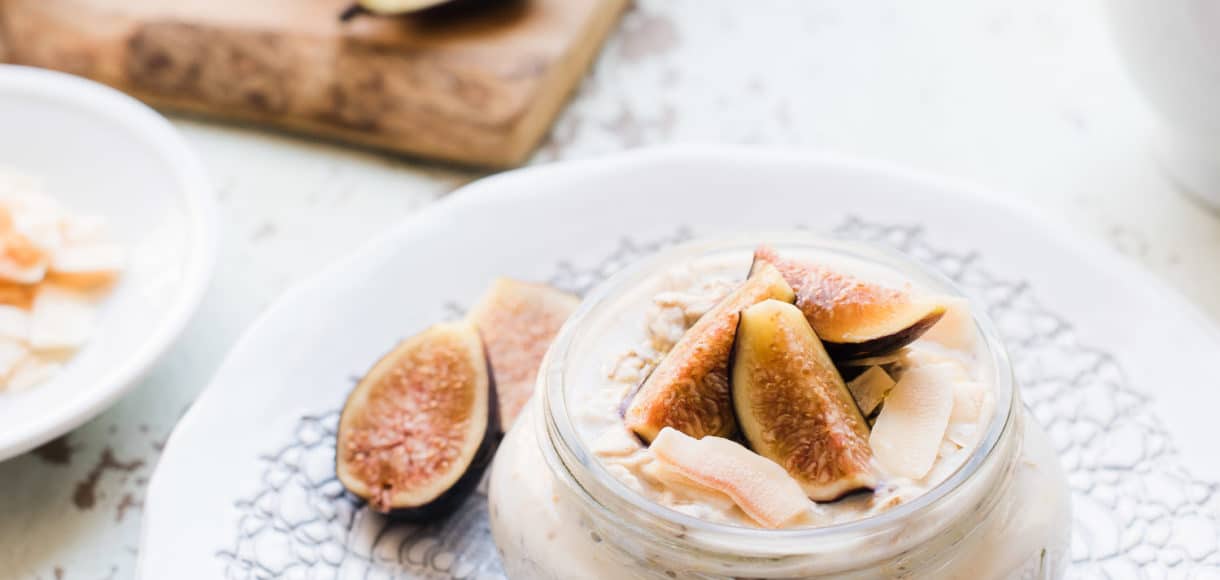 Overnight Oats in mason jar topped with figs and coconut.