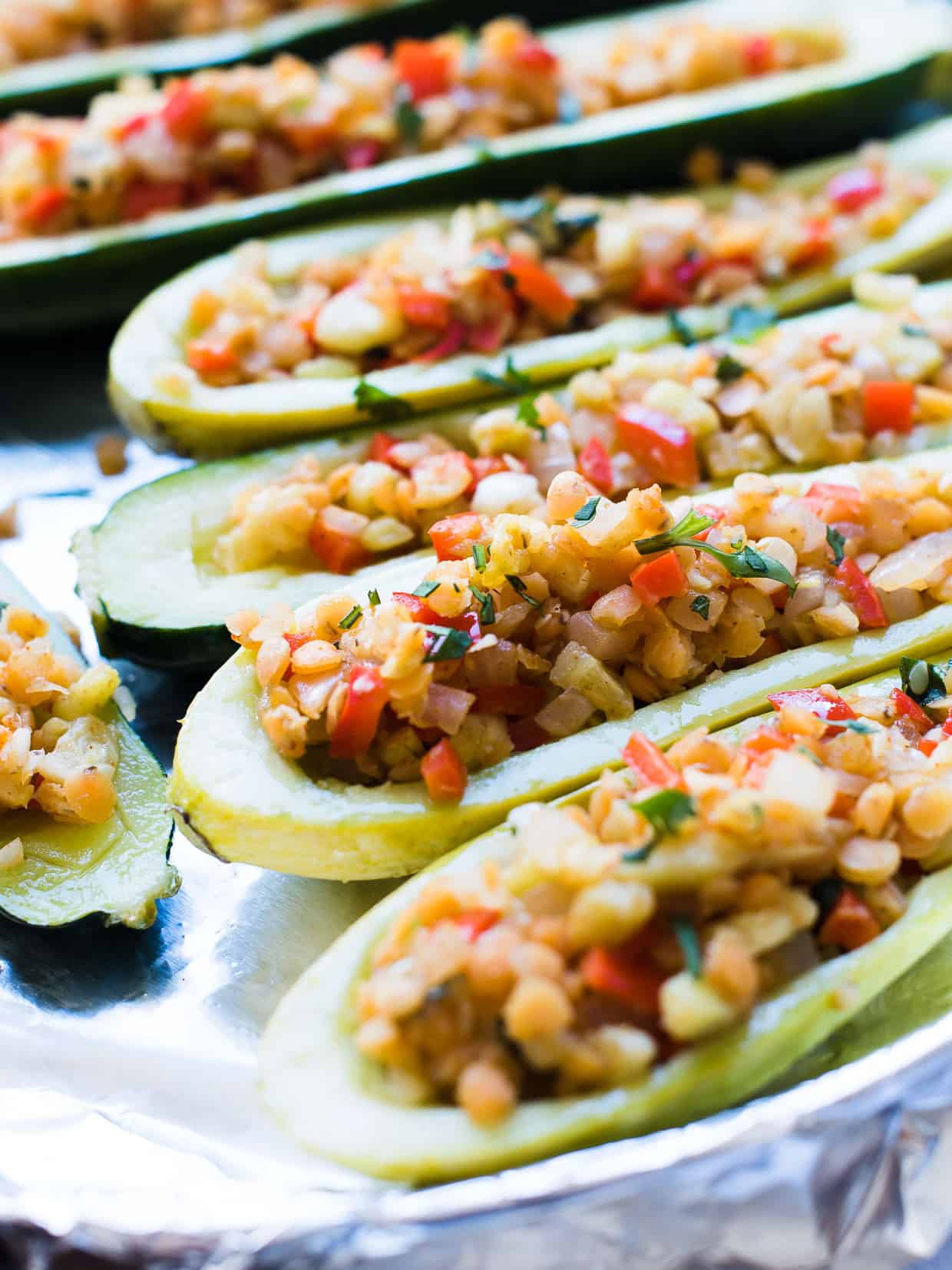 Stuffed yellow squash and zucchini with a tasty lentil filling.