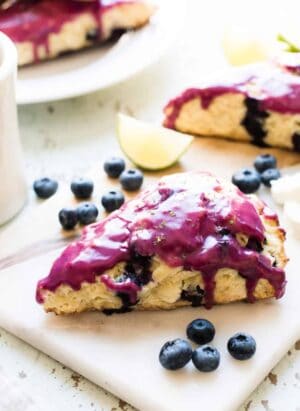 Big, fluffy, blueberry goat cheese scones with a glaze so irresistible, that anyone will crumble at the sight of them.