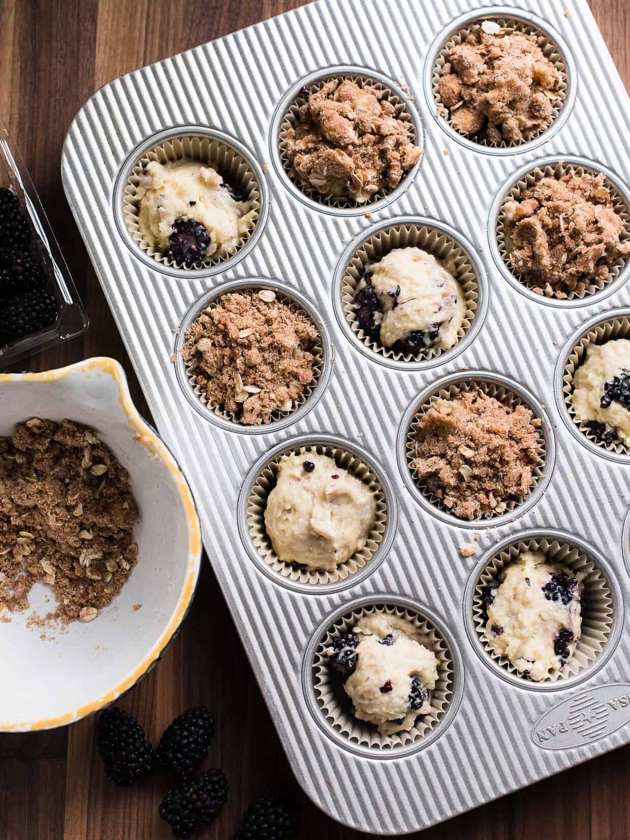 Blackberry Yogurt Muffins in a muffin tin ready to be baked. 