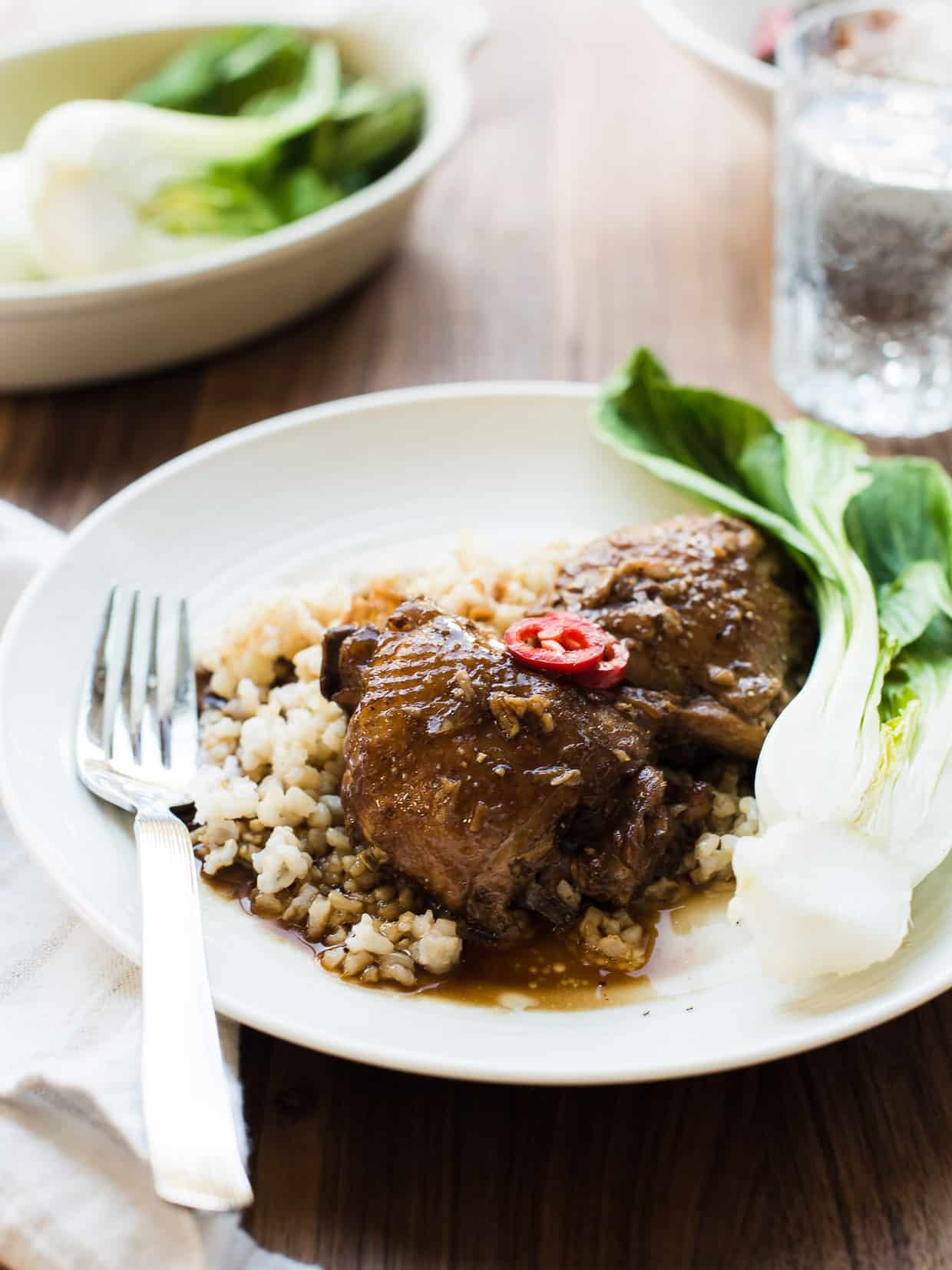 Plate of Filipino Chicken Adobo served over rice - the ultimate comfort food.