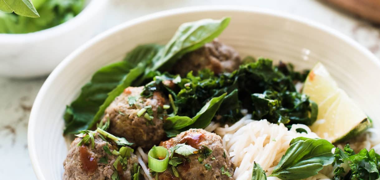 Thai-style Meatballs with Rice Noodles served in a white bowl.