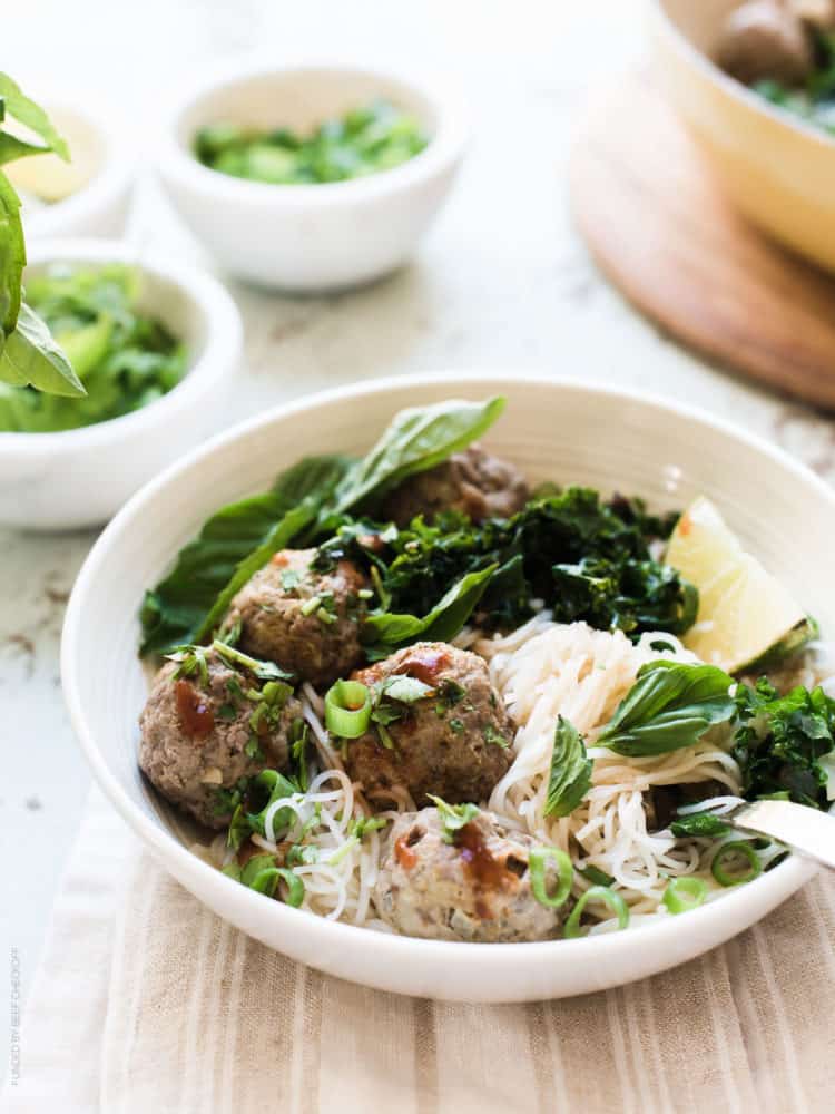 Thai-style Meatballs with Rice Noodles served in a white bowl.