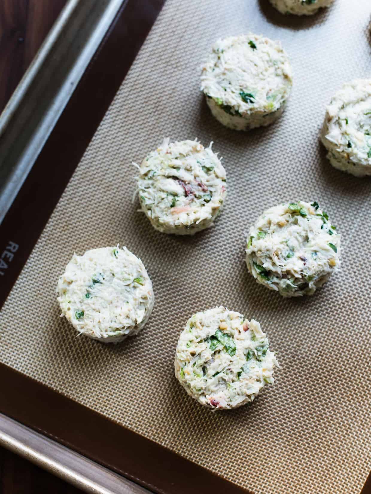 Chickpea Crab Cakes on a baking tray ready to go into the oven.