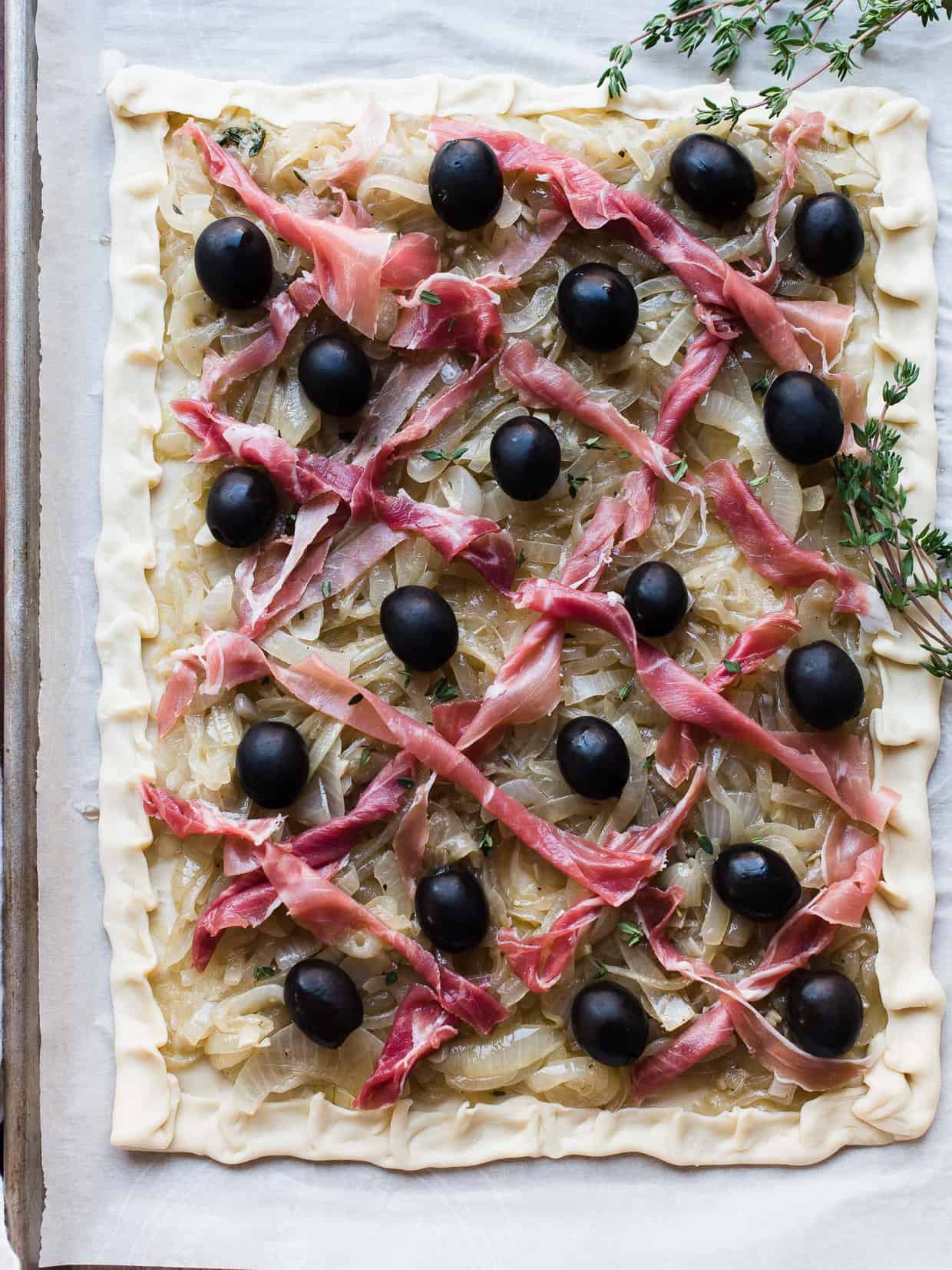 Making a Pissaladière with Prosciutto is a nice alternative to the traditional anchovy. Made with Lindsay Olives. #ad