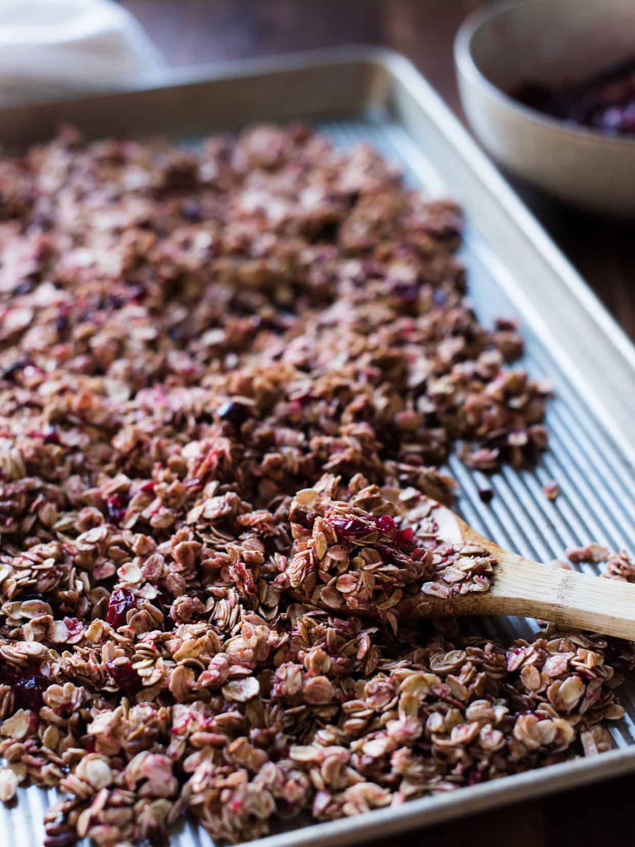 Sheet pan filled with Cranberry Sauce Granola to bake.