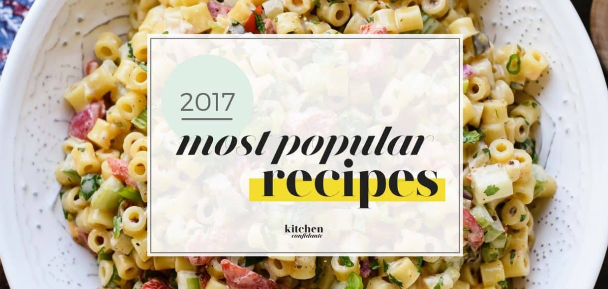 The Most Popular Kitchen Confidante Recipes of 2017 graphic over a bowl of pasta salad.