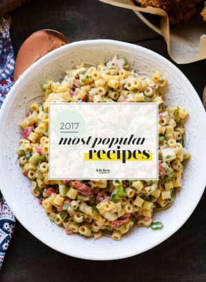 The Most Popular Kitchen Confidante Recipes of 2017 graphic over a bowl of pasta salad.