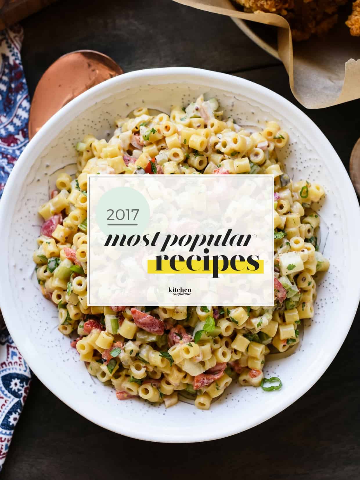 The Most Popular Kitchen Confidante Recipes of 2017 graphic over a bowl of pasta salad.