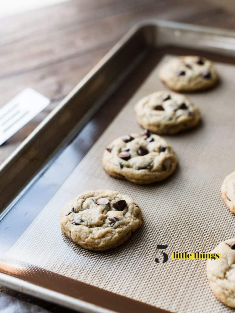 Cream Cheese Chocolate Chip Cookies fresh out of the oven on a baking tray.