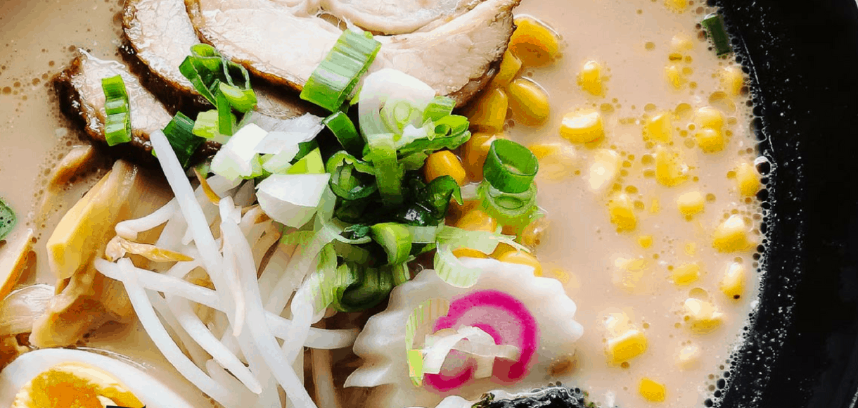 Bowl of ramen with narutomaki, ramen egg, chasu pork.