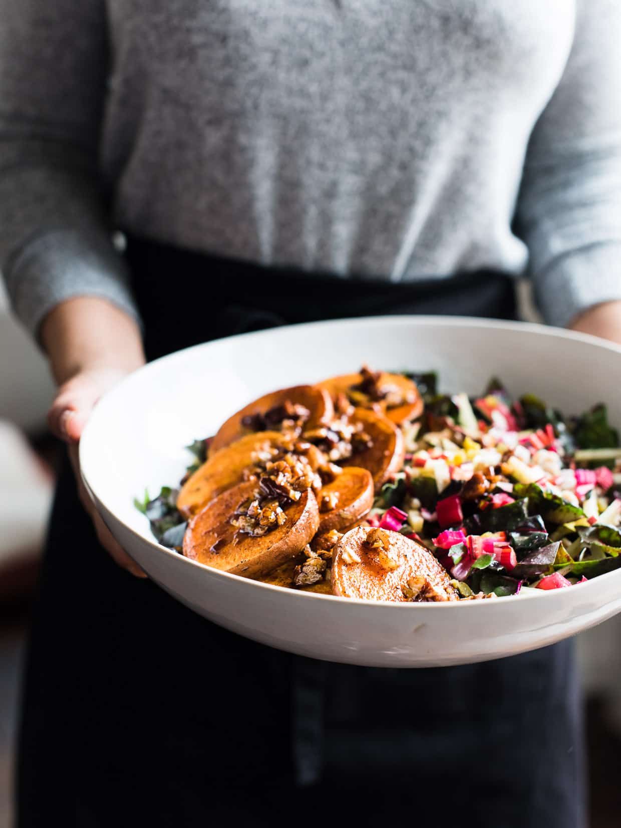 woman holding bowl of Winter Farro Salad with sweet potato and chard from Green Chef