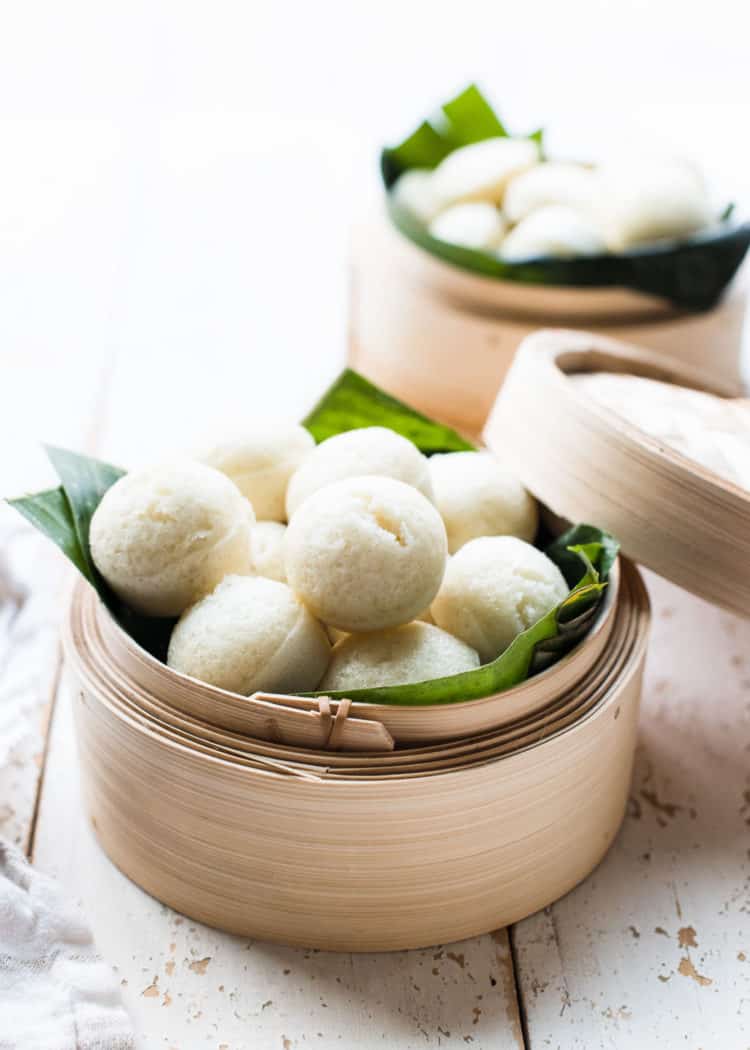 Puto - steamed rice cakes from the Philippines - in a bamboo steamer.
