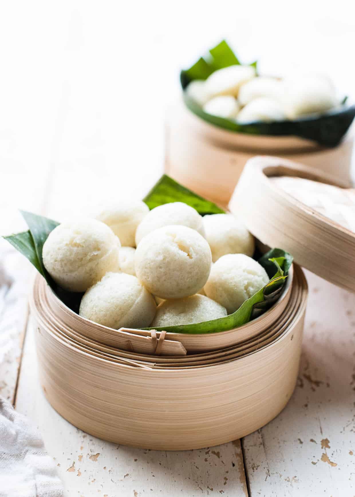Puto - steamed rice cakes from the Philippines - in a bamboo steamer.